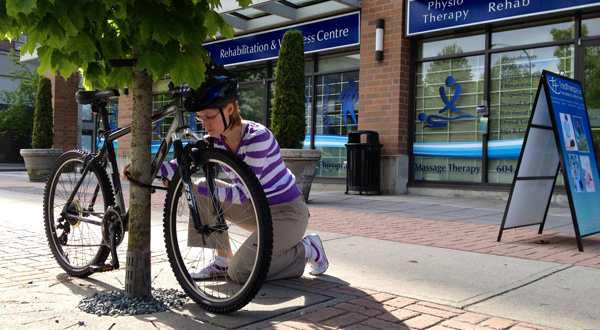 Jennifer with Bike at Total Therapy Physiotherapy Burnaby Vancouver